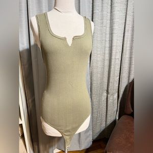 Women’s green bodysuit